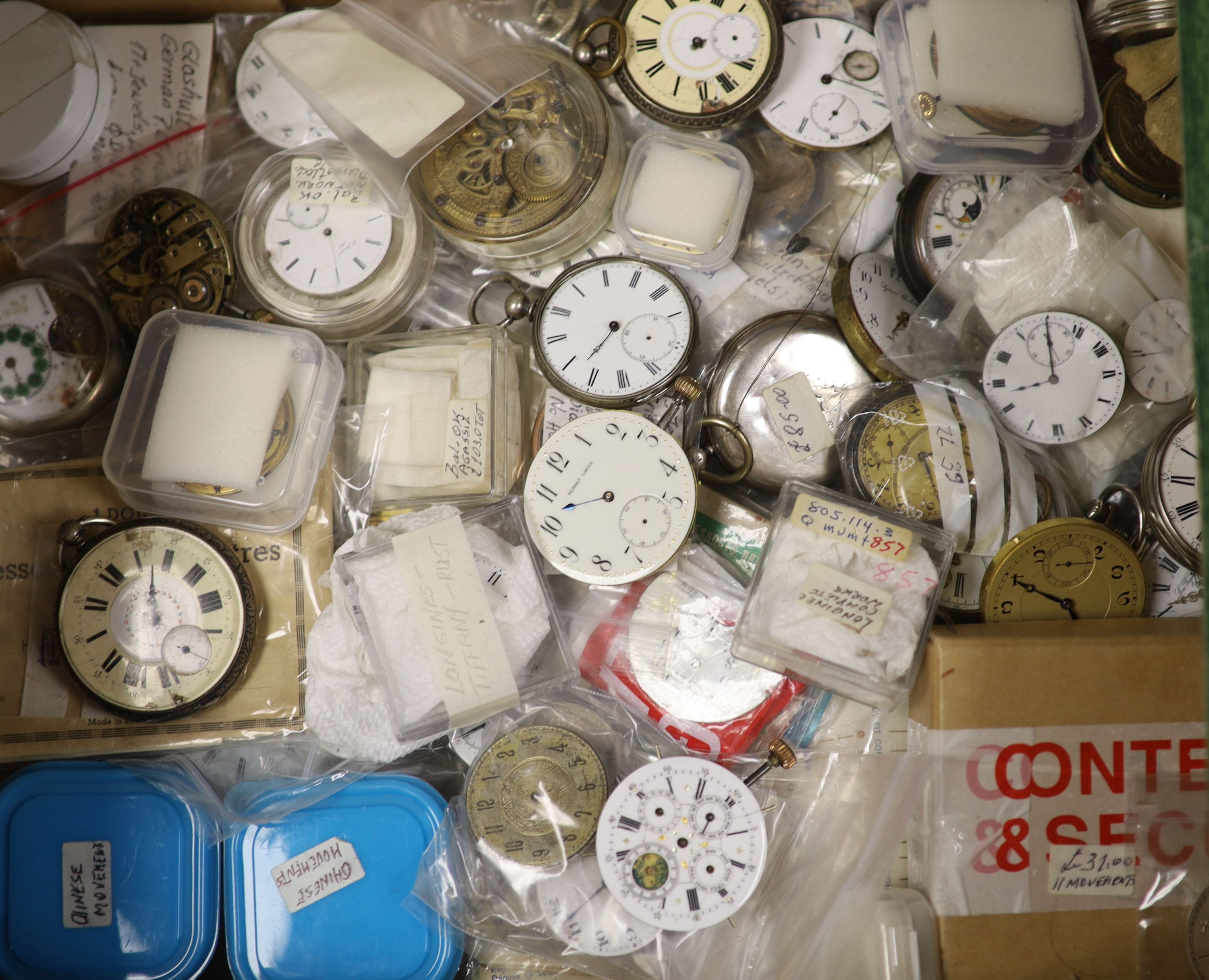 A large quantity of assorted pocket watch movements, parts and accessories